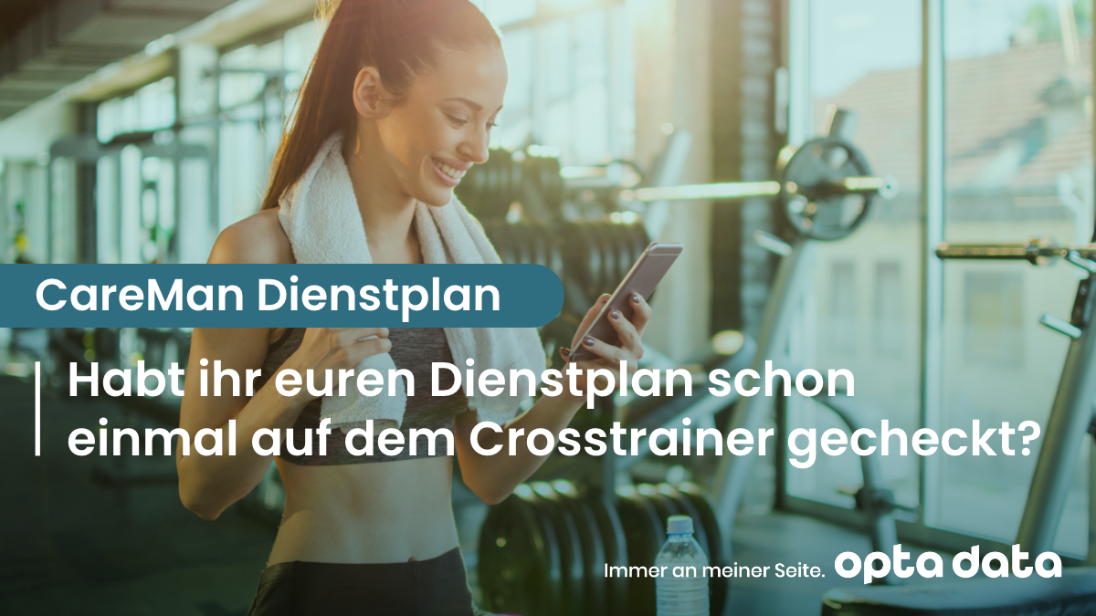 Frau auf Crosstrainer mit Handy